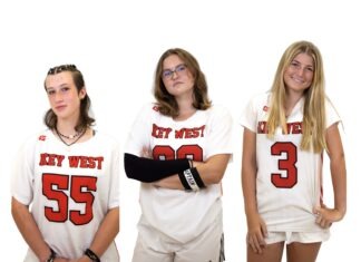 a group of young women standing next to each other